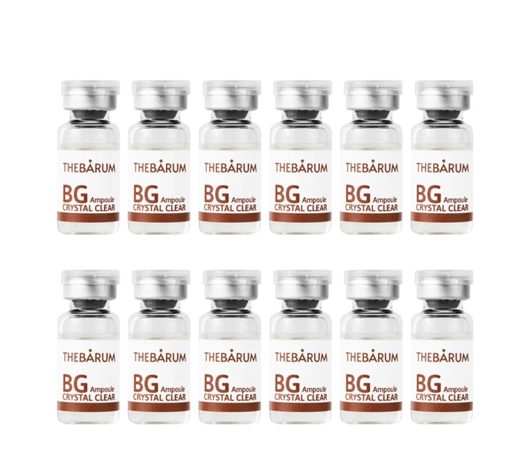 Twelve small clear glass vials with silver caps arranged in two rows of six on a plain white background. Each vial has a white label with brown text reading THEBÁRUM, BG Ampouh, CRYSTAL CLEAR.