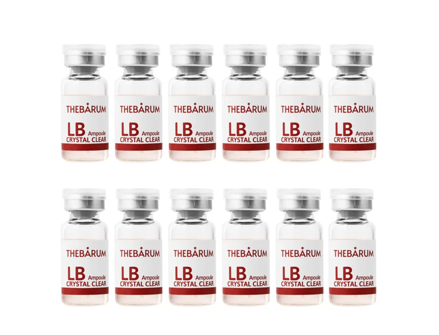 Twelve small cosmetic vials arranged in two rows of six on a plain white background. Each vial has a silver cap and a white label with red text reading THEBÁRUM and LB Ampoule CRYSTAL CLEAR.