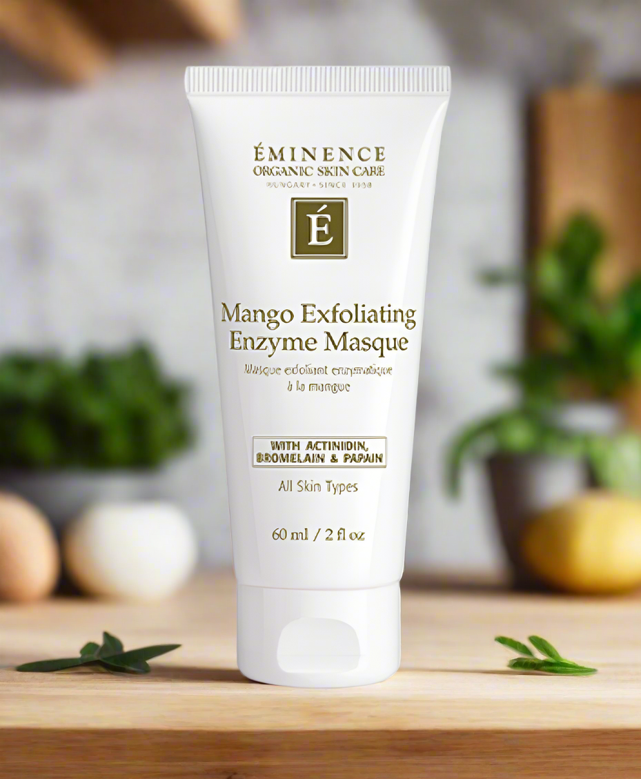 White tube of Éminence Mango Exfoliating Enzyme Masque on a wooden surface.